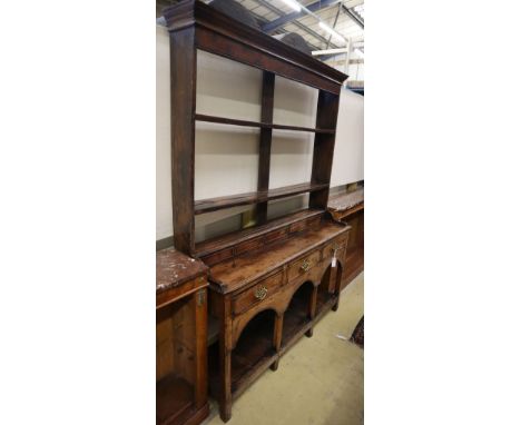 A small George III and later oak dresser, W.125cm, D.36cm, H.184cmCONDITION: Overall a very nice faded colour, general dentin