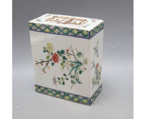 A Chinese famille rose pillow, late 19th century, height 15cmCONDITION: Generally a little worn to the paint, a few light sur