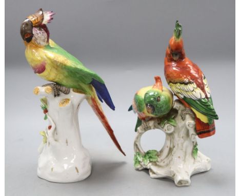 Two Continental porcelain Birds of Paradise groups, height 27cmCONDITION: Single bird has a chip to the feathers on the crown