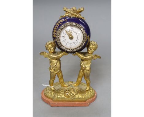 A French gilt metal and enamel cherub timepiece, height 18.5cm