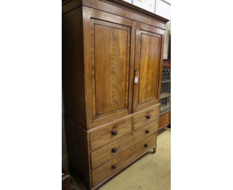 A Regency mahogany linen press, W.124cm, D.52cm, H.200cmCONDITION: Overall a nice faded appearance, some minor chipping, scra