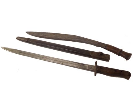 Early 20th century steel bayonet with wooden hilt and leather scabbard, 22" long; together with a wooden handled machete 1.5"