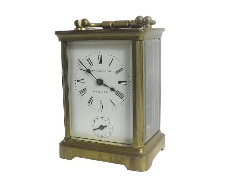 Brass alarm carriage clock in a corniche case striking on a bell, the dial signed Edward & Sons;  together with a green leath