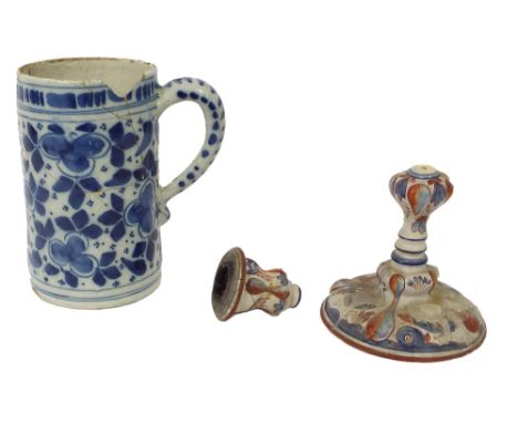 Antique Delft blue and white tankard, 7" high (a.f); together with a polychrome Continental Delft candlestick, 7" high (a.f) 