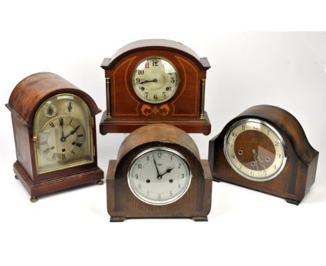 A mahogany mantel clock, 20th Century, with arched case, Roman numeral chapter ring, chine silent and slow/fast dials, 31cm h