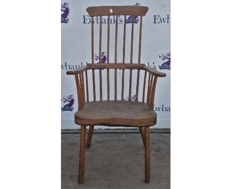 A 19th Century elm stick back armchair with solid seat raised on turned supports.114cm high x 58cm deep x 61cm wide.Condition