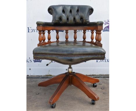 Swivel office chair, 20th century, upholstered in green button back leather