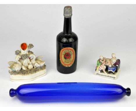 A reproduction money box, ceramic figurines and a correspondence box.