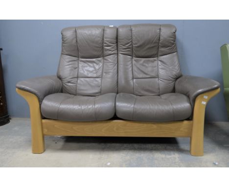 Stressless, a two seat sofa, with leather upholstery, 105cm high x 154cm wide x 83cm deep