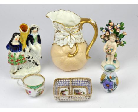 Two Victorian jugs, together with two Staffordshire figures, various porcelain cups and saucers, an English porcelain figure 