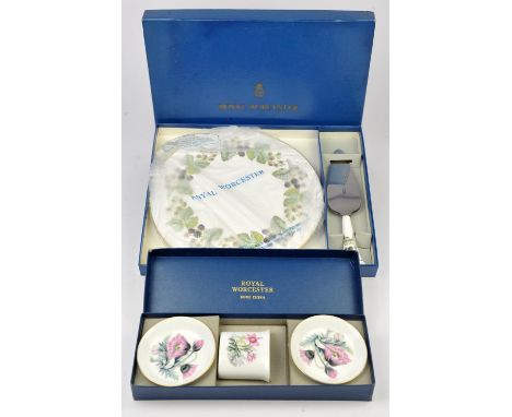 Royal Worcester porcelain cake platter, with silver line decoration, 28.5cm diameter, in original box, together with a simila