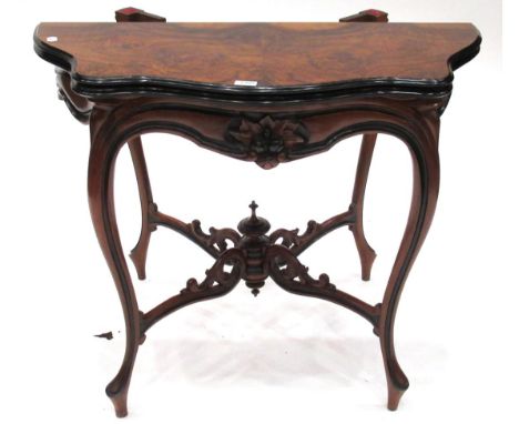 A Victorian Burr Walnut and Ebonised Foldover Card Table, late 19th century, of serpentine shaped form, with hinged lid enclo