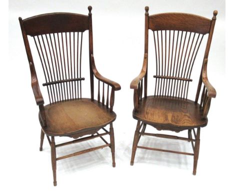 Two Thames Valley Beech, Elm and Oak Stick Back Chairs, with solid top rails above spindles, the arms raised on spindles, sha