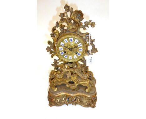 A Gilt Metal Striking Mantel Clock, signed Raingo A Paris, circa 1840, case with floral and scroll decoration, cast dial with