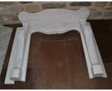 A Louis IV Style Carved White Marble Chimney piece, modern, with serpentine shaped mantel shelf,125cm wide