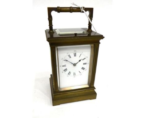 A Brass Striking and Repeating Carriage Clock, circa 1900, carrying handle and repeat button, enamel dial with Roman numerals