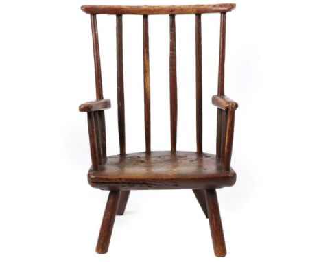 A Welsh Child's Primitive Stick-Back Ash Armchair, late 18th/ early 19th century, with traces of red and green paint, the cur