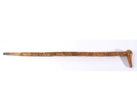 A Carved Wood Walking Stick, possibly a Welsh Love Token, 19th century, carved with a variety of figures in various poses and