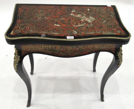 A French Ebonised, Red Tortoiseshell and Brass Inlaid Boulle Style Card Table, circa 1850, of serpentine shaped form, the hin
