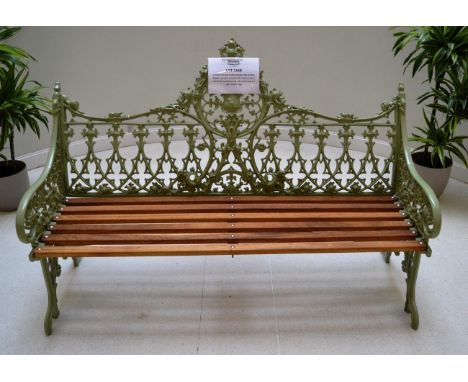 A Green Painted Coalbrookdale Style Garden Bench, cast with a shield within gothic tracery and flower ornament and with slatt