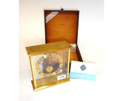 A Gilt Brass Mantel Timepiece, signed Jaeger LeCoultre, circa 1975, rectangular form case with glass panels, underside of the