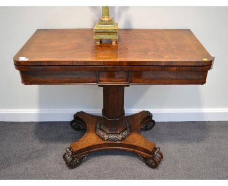 An Early Victorian Rosewood Foldover Card Table, circa 1840, the plain frieze centred by a tablet, on a chamfered support wit