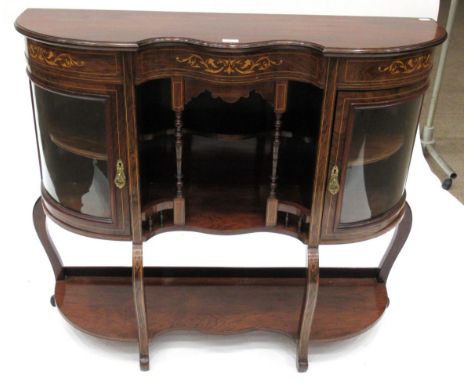 A Victorian Rosewood and Marquetry Inlaid Chiffonier, late 19th century, of serpentine shaped form above spindle support and 