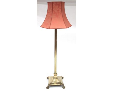 A Late 19th/Early 20th Century Brass Corinthian Column Adjustable Standard Lamp, the square platform base on ball and claw fe