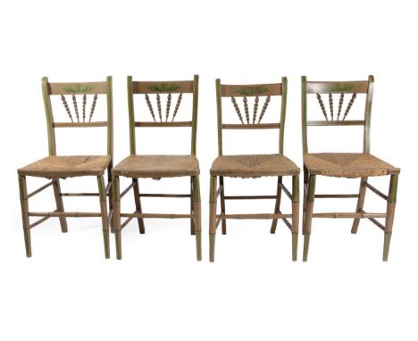 A Set of Four Brown and Green Painted Rush-Seated Chairs, early 19th century, with bobbin turned splays and curved seat rails