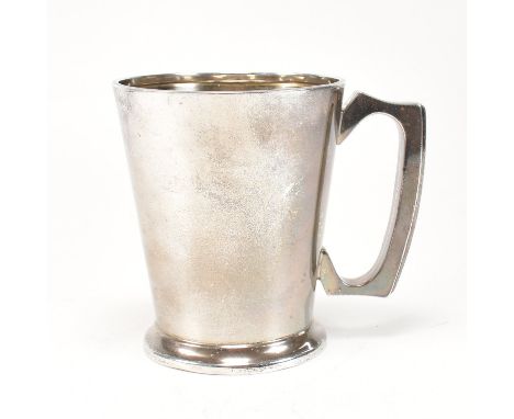 A George V hallmarked silver tankard. The tankard having a stepped base rising to tapered form with c shaped handle. Hallmark