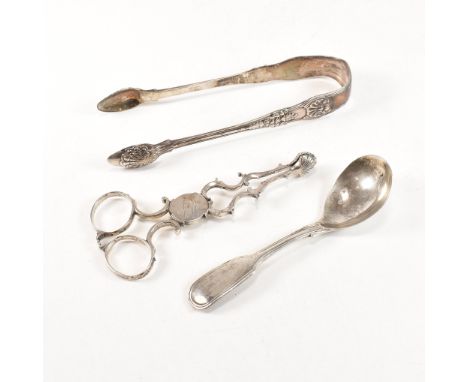 A collection of Georgian hallmarked silver flatware items. The lot to include two pairs of early 19th century sugar tongs to 