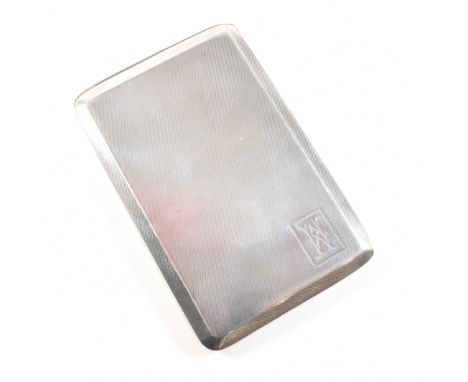 A George V hallmarked silver cigarette case. The 1920's Art Deco case having an engine turned finish with monogrammed cartouc