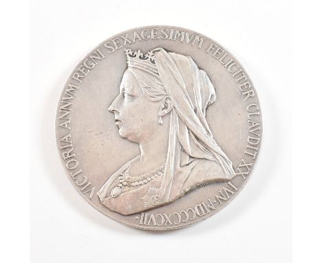 A silver commemorative medallion coin for Queen Victoria 1897 Diamond Jubilee . The silver medal depicting 'Old head' bust le