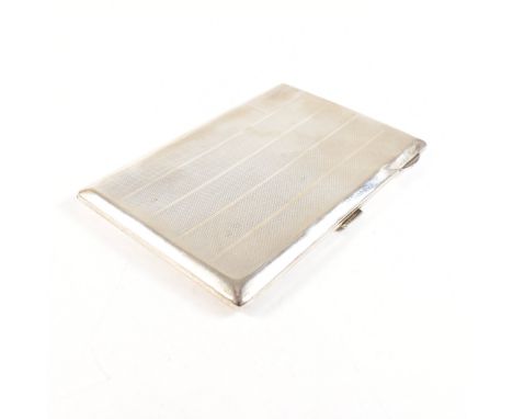 A George V hallmarked silver cigarette case. The Art Deco case having an engine turned stripe pattern with vacant cartouche t