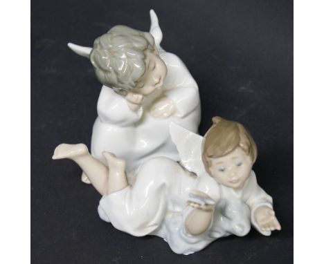 Lladró; two ceramic figures of robed cherubs
