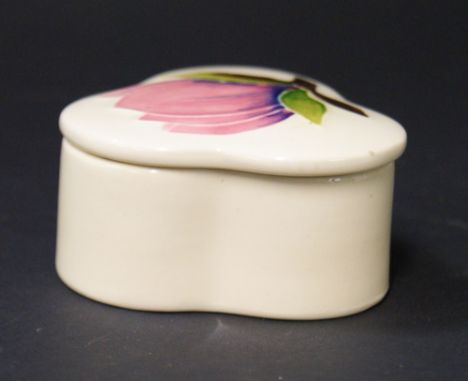 Moorcroft; a small trefoil trinket box and cover with pink magnolia on a green ground