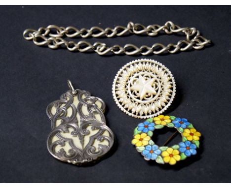 Arts and Crafts silver and floral enamelled circular brooch, silver chain and a Victorian white metal and ivory-set notepad C