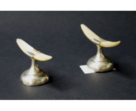 Two hallmarked silver and mother of pearl knife rests (A/F)