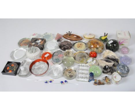 A collection of glass paperweights, including examples by Caithness and Mdina, together with geological specimens and a selec