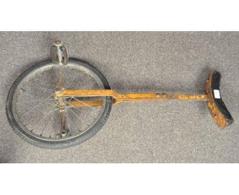 A vintage unicycle, painted metal frame with attached saddle, 90cm high