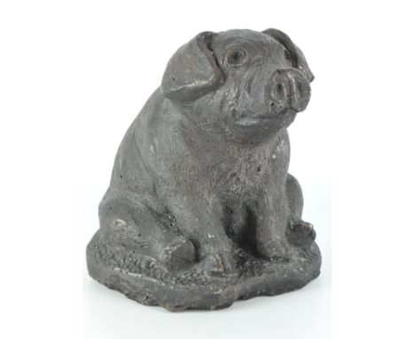 A contemporary stone model of pig, in a seated pose with bronzed effect glaze, height 22cm