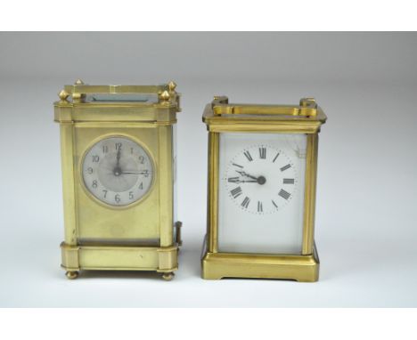 An Edwardian brass cased carriage clock, the silvered dial with Arabic numerals denoting hours, case stamped "R&amp; Co made 