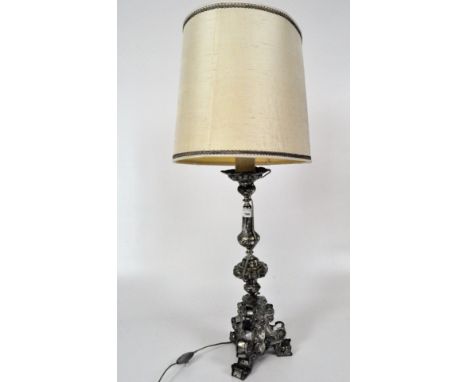 A silvered metal Italian Church candlestick-lamp with ornate moulding, height to candle fitting 50cm