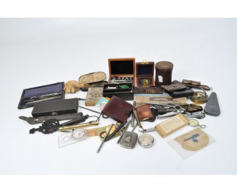 A group of vintage small scales, measuring and drawing instruments, two compasses, and other items