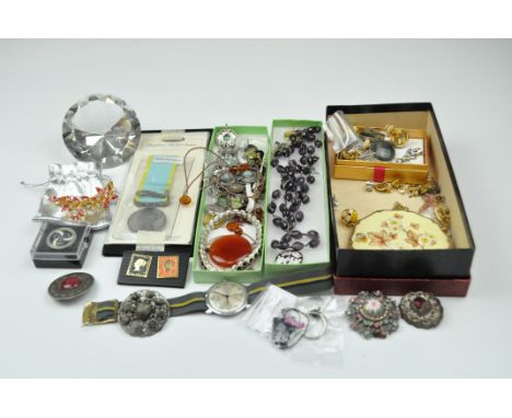 A selection of vintage costume jewellery, including a Timex, bracelet, brooches and other pieces