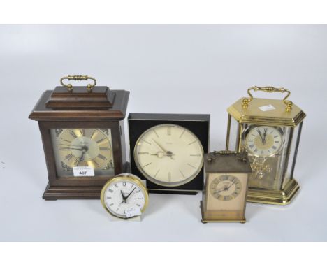 Five contemporary clocks, including an Acctin skeleton example in a brass frame, a Sabre carriage clock, Bentima mantel clock