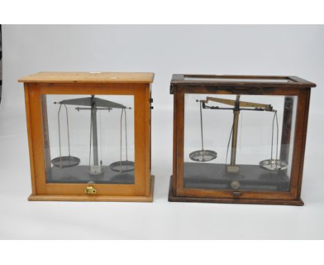 Two sets of scales, one by Griffin &amp; Tatloch Ltd, in wood framed glass cases measuring 41cm x 44cm x 23cm, and 41cm x 42c
