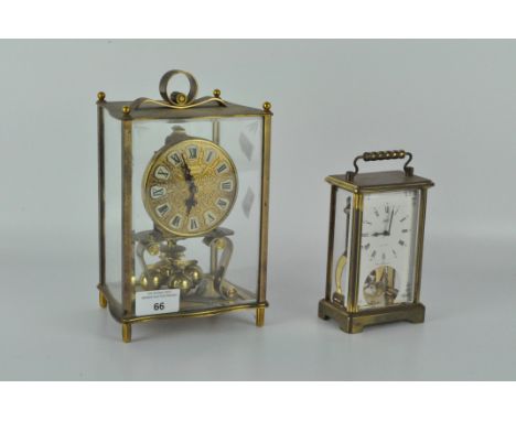 A contemporary Kundo carriage clock, in a brass skeleton case, height 23cm; together with a Schatz carriage clock, height 16c