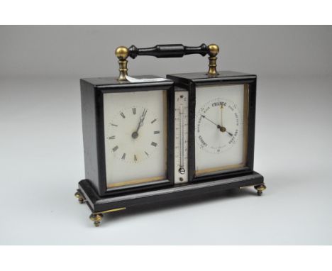 An early 20th century Aneroid clock/thermometer/barometer, black painted case with brass mounted handle to top