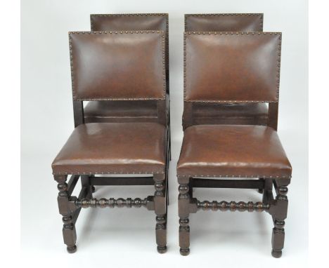 A set of four 20th century dining chairs, upholstered in brown leather with studs, bobbin turned supports, height 92cm